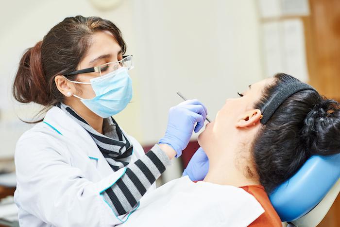 A dentist treating a patient at Bright Smile Clinic